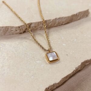 Gold rope necklace with pearl charm